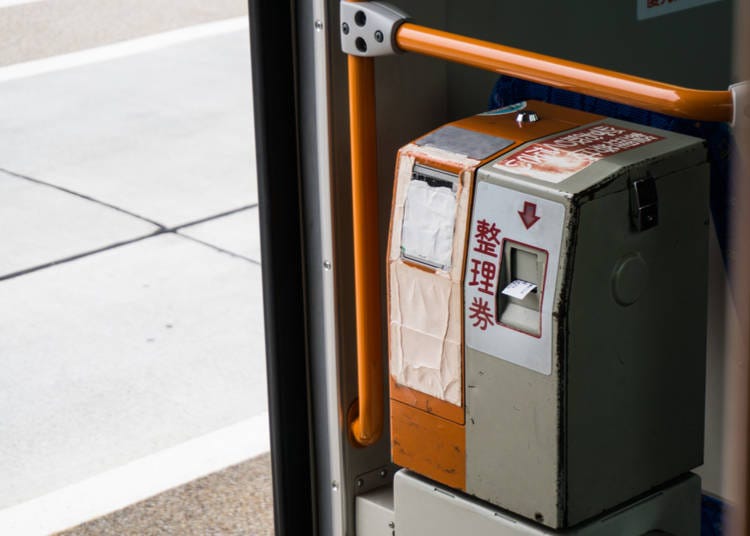 Ticket machine near the rear entrance to a bus