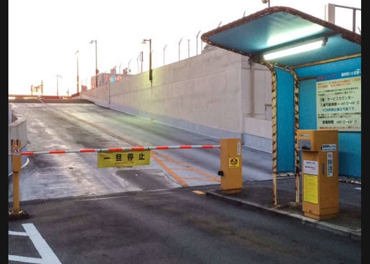 A parking garage with an automatic barrier