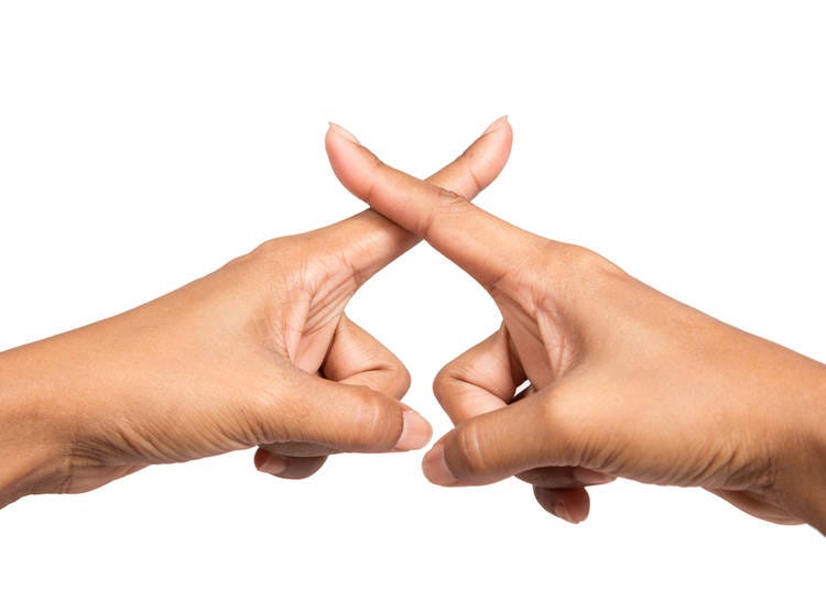 Making an "X" with your fingers - check please!