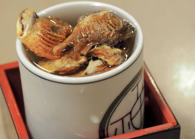 A Cup of Hirezaki (Hot sake with charred Fugu Fins) (Image: PIXTA)