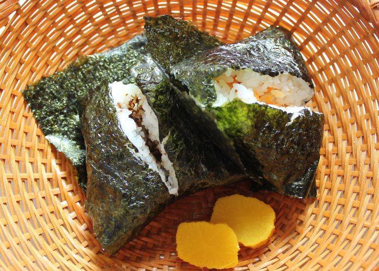 The ami (opossum shrimp) onigiri is on the left, while miso pickled ginger can be seen on the right.