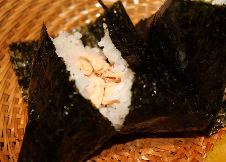 A salmon onigiri, generously filled.