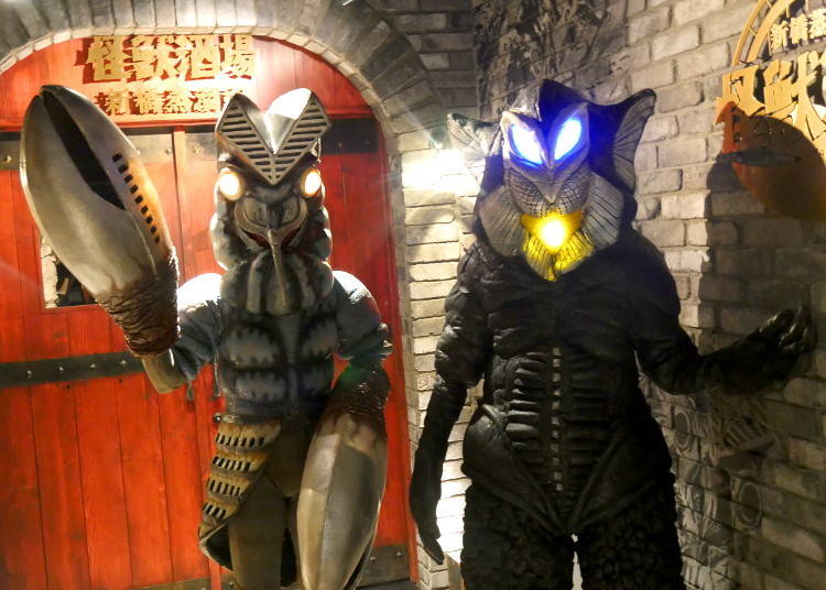 Alien Baltan on the left and their colleague Alien Mefilas on the right welcome you to Kaiju Sakaba!