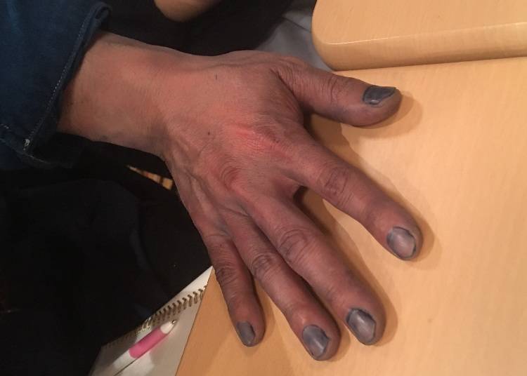 The dyed hands of aizome artisans – even the nails are blue.