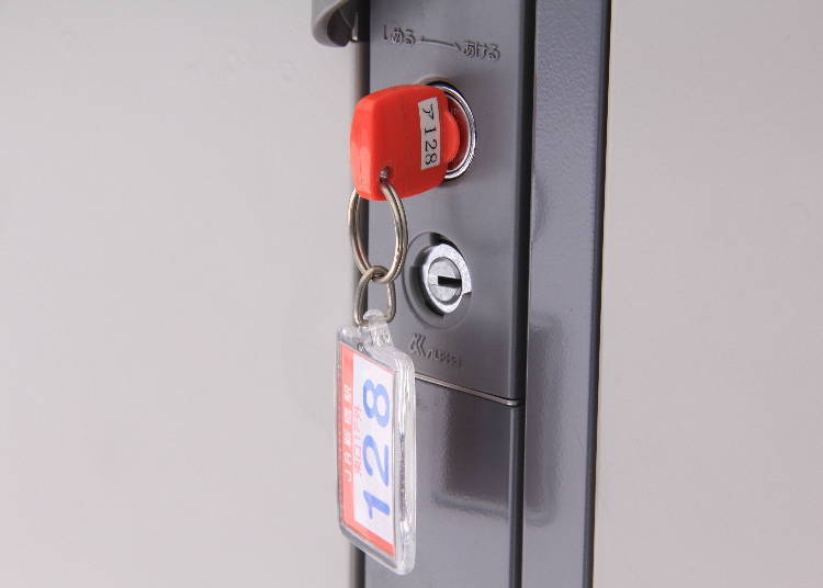 A key-type coin locker. The locker’s number and location are written on the keychain.