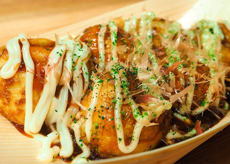 Takoyaki is a ball shaped snack made from flour based batter and filled with diced octopus and other ingredients.
