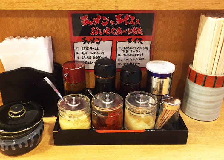 Back: gyoza (dumplings) sauce, soy sauce, vinegar, chili oil and peppers Front: Ginger, miso, garlic The little pot (front left) contains pickles.