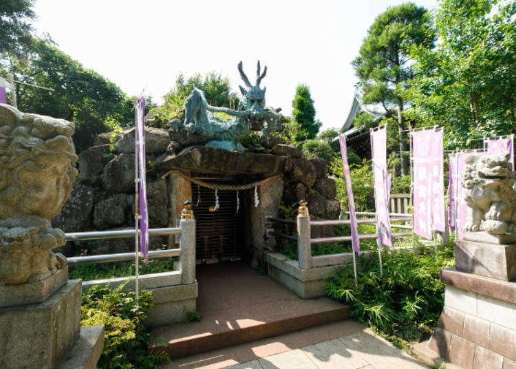 The dragon deity gazes over the area with a stern expression.