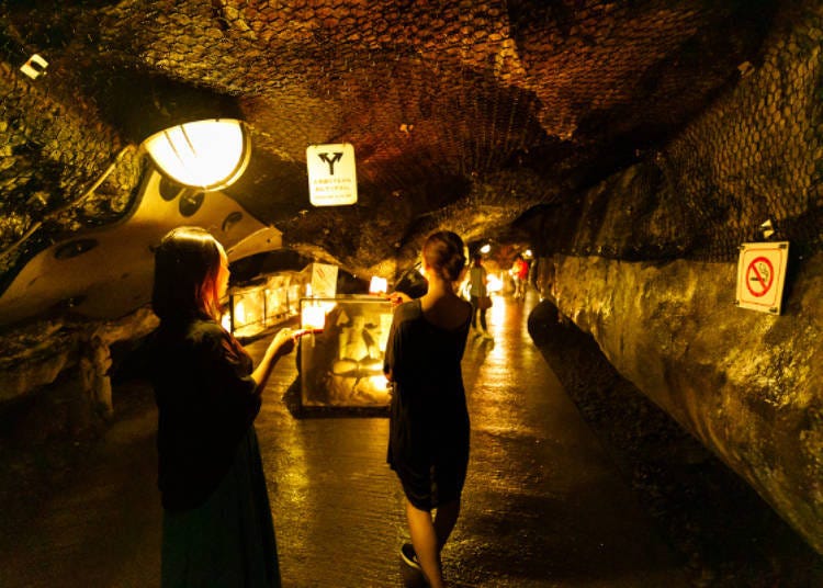 Walking Iwaya Cave #1 with a candle in our hands.