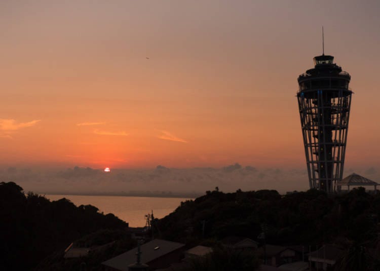 The orange sunset over Enoshima with the Sea Candle on the right.