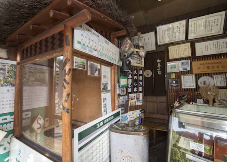 The store is full of timetables and station signs, all of which are authentic