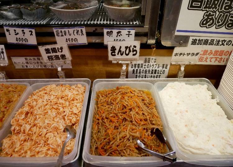 From the right: potato salad, kinpira (burdock root with sugar and soy sauce), kama-age sakura-ebi (straight-from-the-pot sakura shrimp)