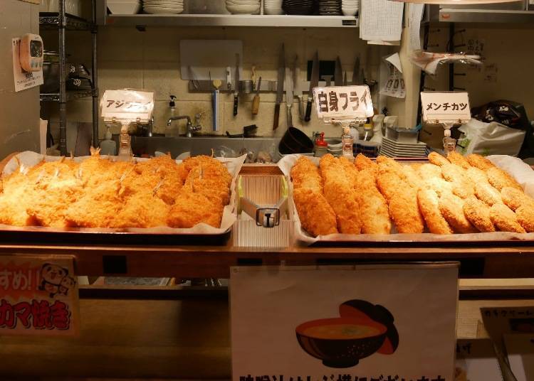 From the right: menchikatsu (deep-fried minced meat ball), deep-fried white fish, deep-fried horse mackerel