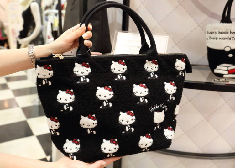 The embroidery makes the bag lightly fluffy, while the white-on-black Hello Kitty design is both chic and playful.
