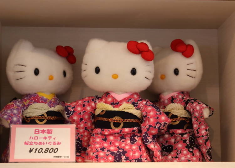 Hello Kitty wearing a fabulous kimono with a cherry blossom pattern.