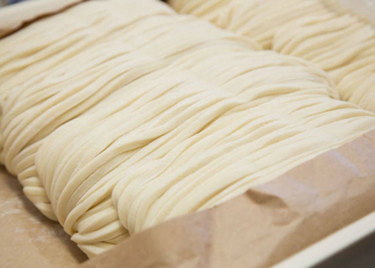 Freshly handmade noodles, prepared early each morning, ready in the kitchen.