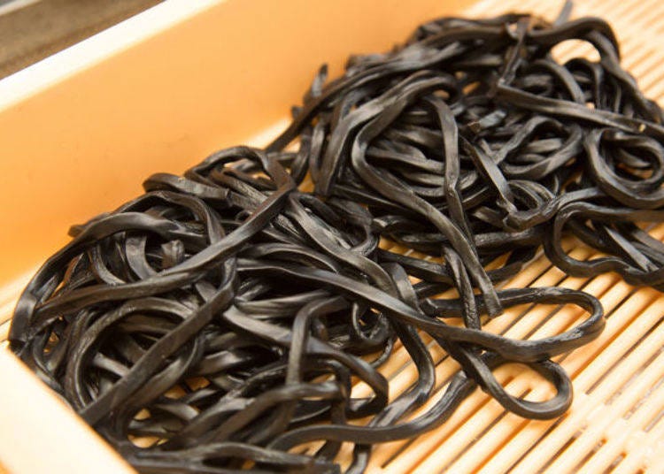 The jet-black charcoal noodles also retain the signature chewy texture characteristic of Yoshida Udon.