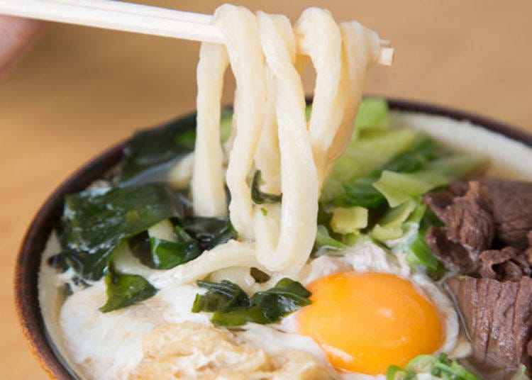 The freshly handmade noodles, boiled immediately, are glossy and smooth.