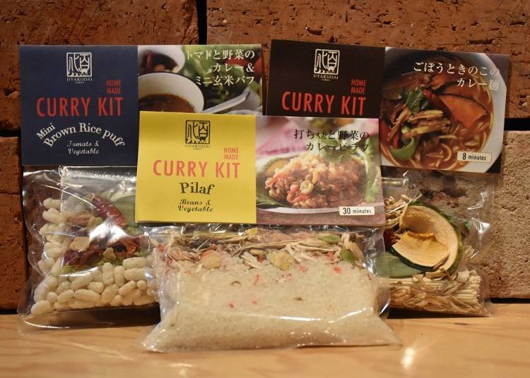 Tomato-vegetable curry and brown rice puffs for 702 yen, soybean curry pilaf for 734 yen, burdock and mushrooms curry noodles for 594 yen (tax included)