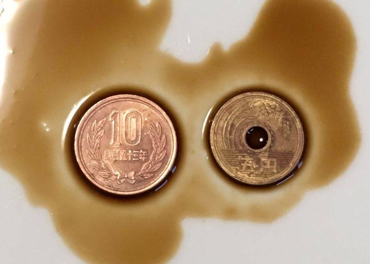 Coins that were immersed in Japanese brown sauce