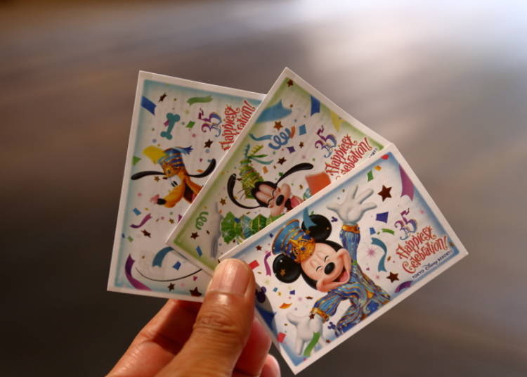 Example of a 1-Day Passport, featuring illustrations of different characters. The passport is necessary for re-entering the park and obtaining a Fast Pass, so be careful not to lose it.