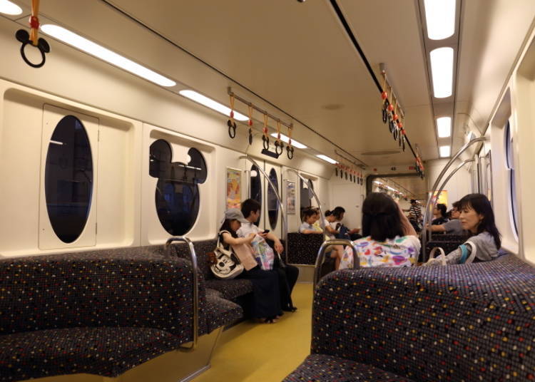 The interior of the train. Even the windows and straps boast a Mickey design.
