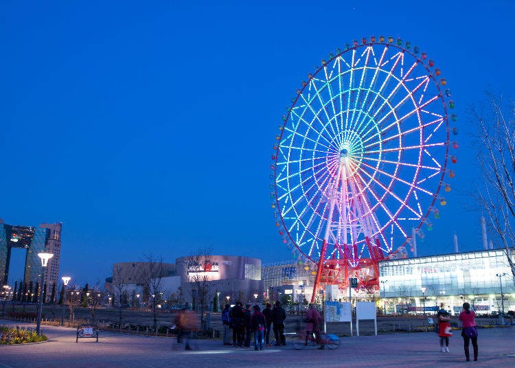 Palette Town’s Big Ferris Wheel brings color to the night sky.