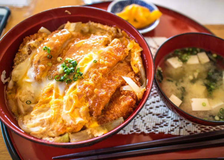 Katsudon: A comforting bowl of rice topped with a breaded pork cutlet and a savory-sweet sauce.