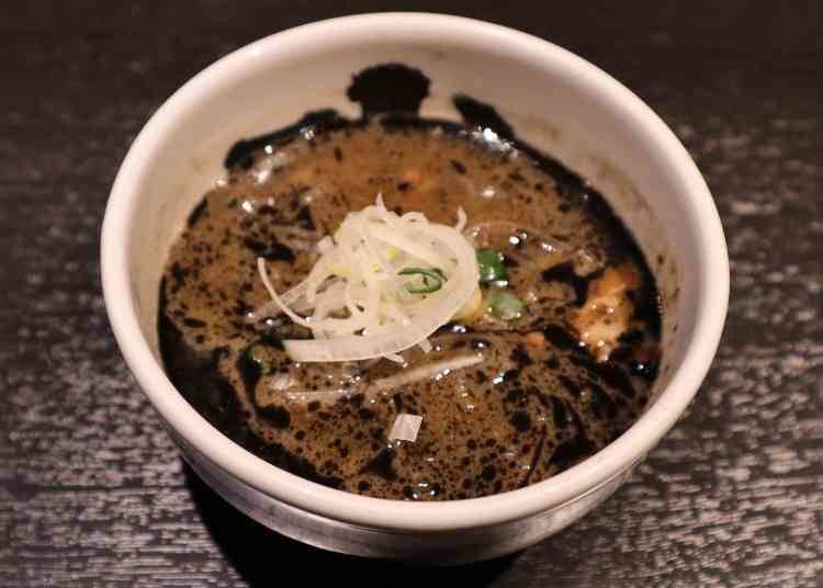 The Charred Black Oil Broth: A Match Made in Heaven for Those Thick Noodles!