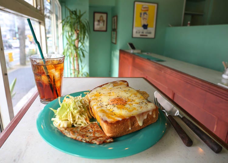 The toad in the hole is a popular breakfast item. This delicious sandwich comes with hash brown potatoes and coleslaw!