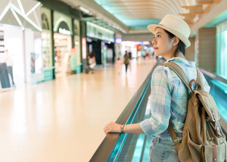 What kind of duty-free shops are in each terminal and where are they located?