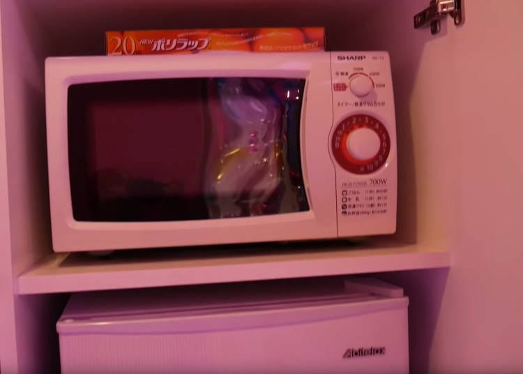 Microwave ovens and mini-fridges are common at love hotels. Photo courtesy of YouTuber @OzzyAwesome.