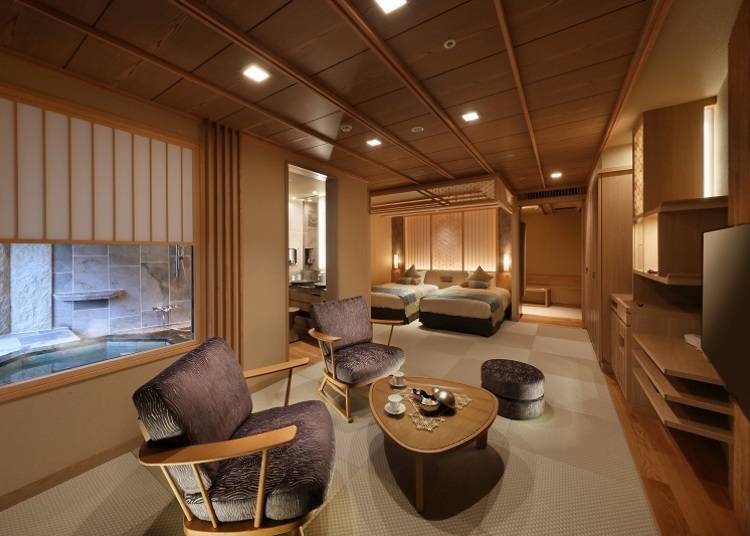 This is a Japanese and Western guest room with an attached landscape bath on the top floor of Shūhōkan wing. The room comes adorned with Tochigi's traditional woodcraft lattices known as Kanuma-Kumiko.