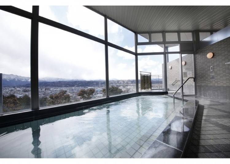 The common bath area features glass walls, allowing you to admire the view outside