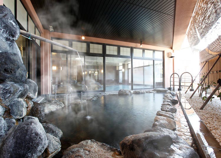 4. Heartpia Atami: Natural hot spring with lie-down baths and cascading baths