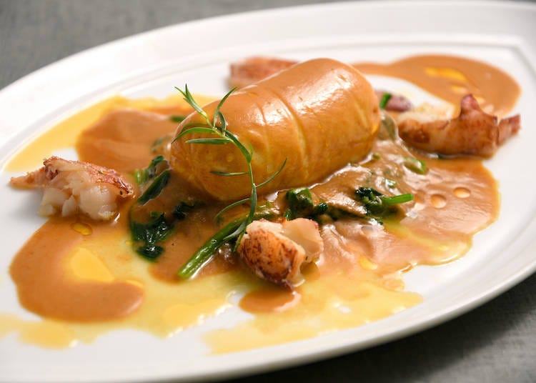 Quenelle of sea bass mousseline and scallops à 2a Lyonnaise with Américaine sauce