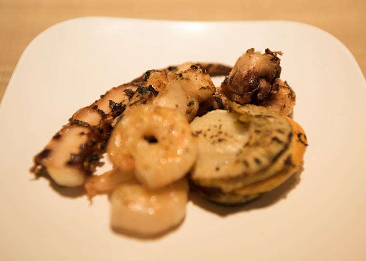 Seafood platter of squid, shrimp, and scallops. The scallop was fluffy and the squid was very tender and superb.