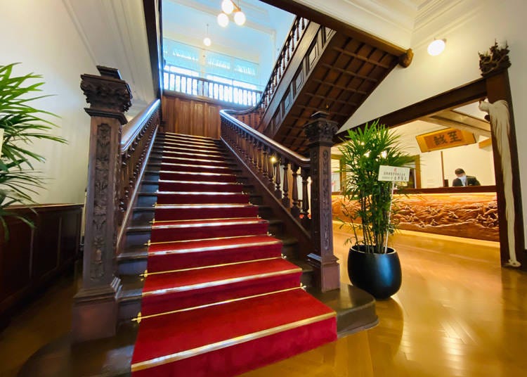 A majestic staircase with scarlet ridges often used for wedding photography