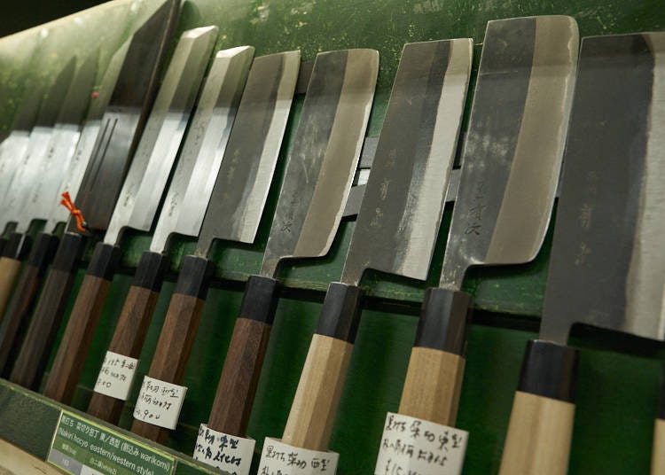 Japanese-style kitchen knives with their distinctive wooden handles.