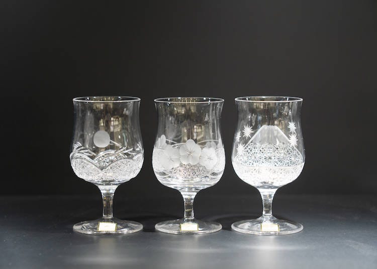 Sake glasses with (left to right) moon, flower, and snow motifs (20,000 yen each, excluding tax).