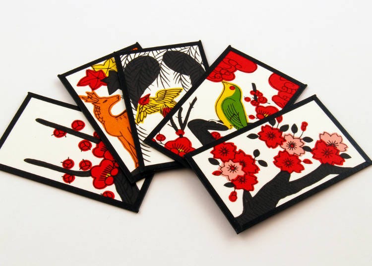 Hanafuda (花札) (The cards on the left end and the second from the right show plum blossoms. The card on the right end shows cherry blossoms.)