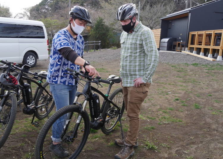 Being patiently taught the way to use the bikes.