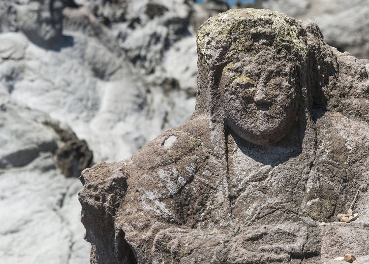 Admire the stone statues of the 16 Arhats