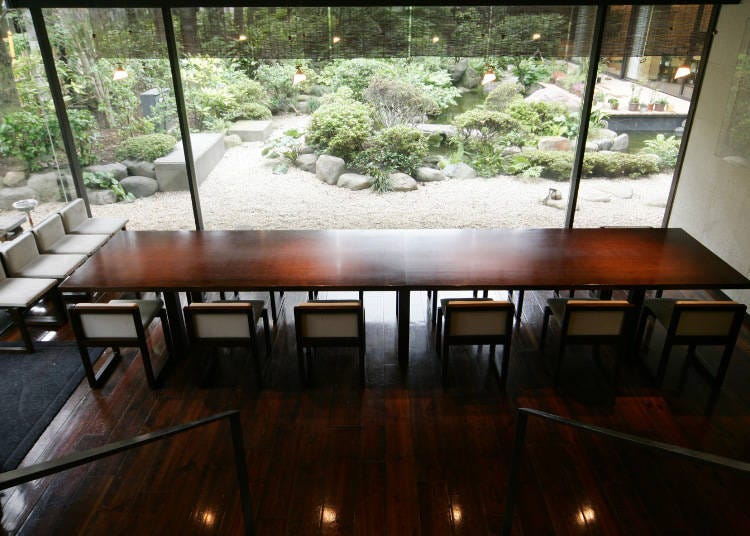 View from the warehouse stairs. A quaint garden lies just outside the large window. (Photo courtesy of Kamachiku)