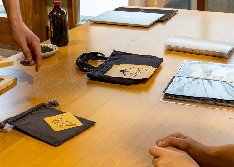 One of our editors chose to dye a tote bag while the other selected a pouch. Each chose a unique, Japanese-inspired design.