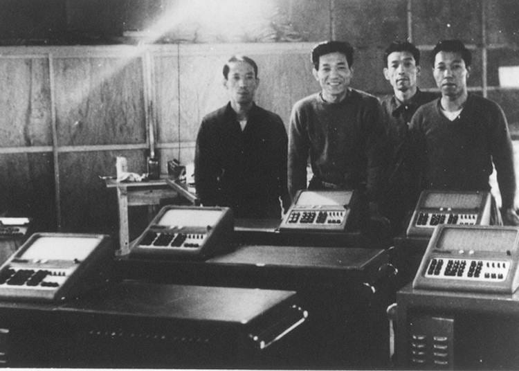 The four Kashio brothers, who succeeded in developing a compact, purely electric (relay) calculator; the 14-A.