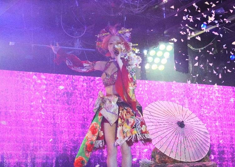 Cherry blossom petals fall onto the stage during a song
