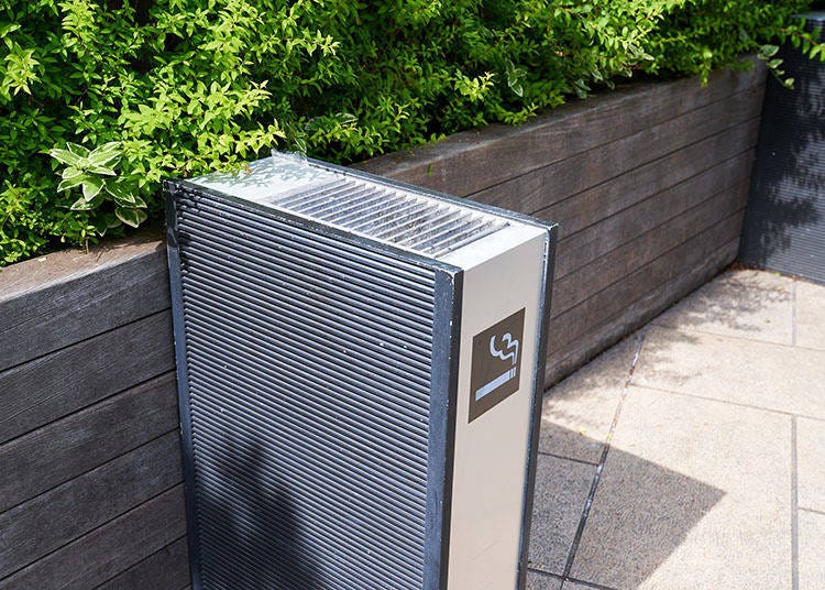 Ashtray placed in a designated smoking area.