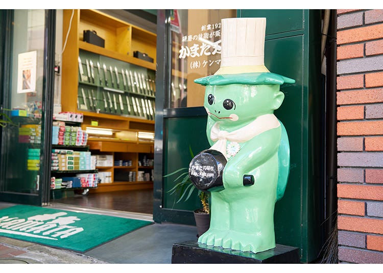 The area mascot called a kappa (river imp) greets guests at the entrance to Kamata Hakensha.