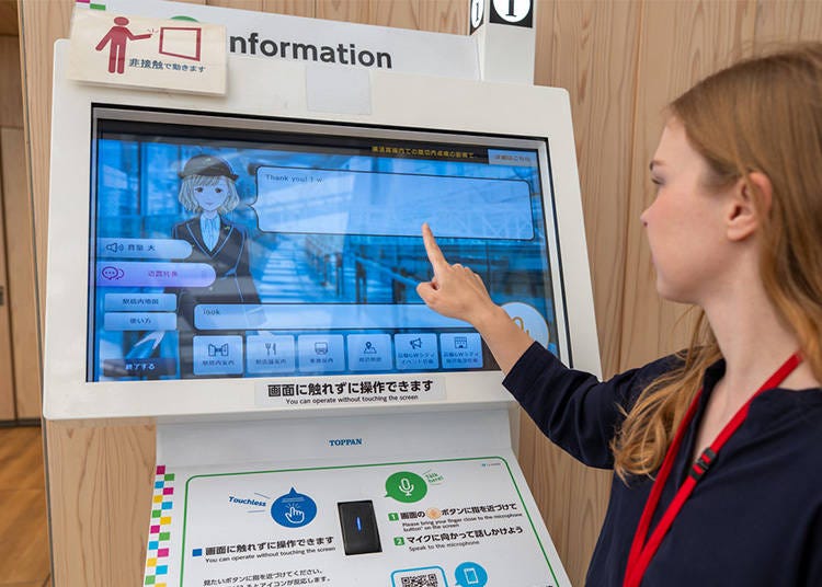 Information display at Takanawa Gateway Station, available in English, Chinese and Korean